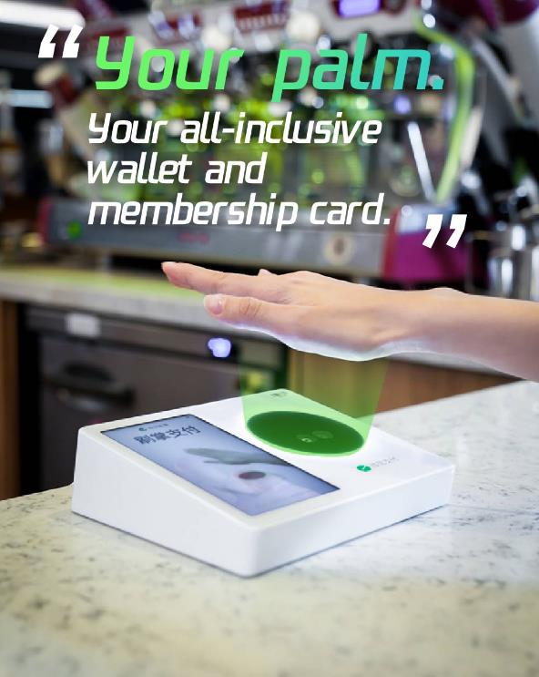 Customer using palm payment at a retail checkout counter — hand hovering over PalmAI device